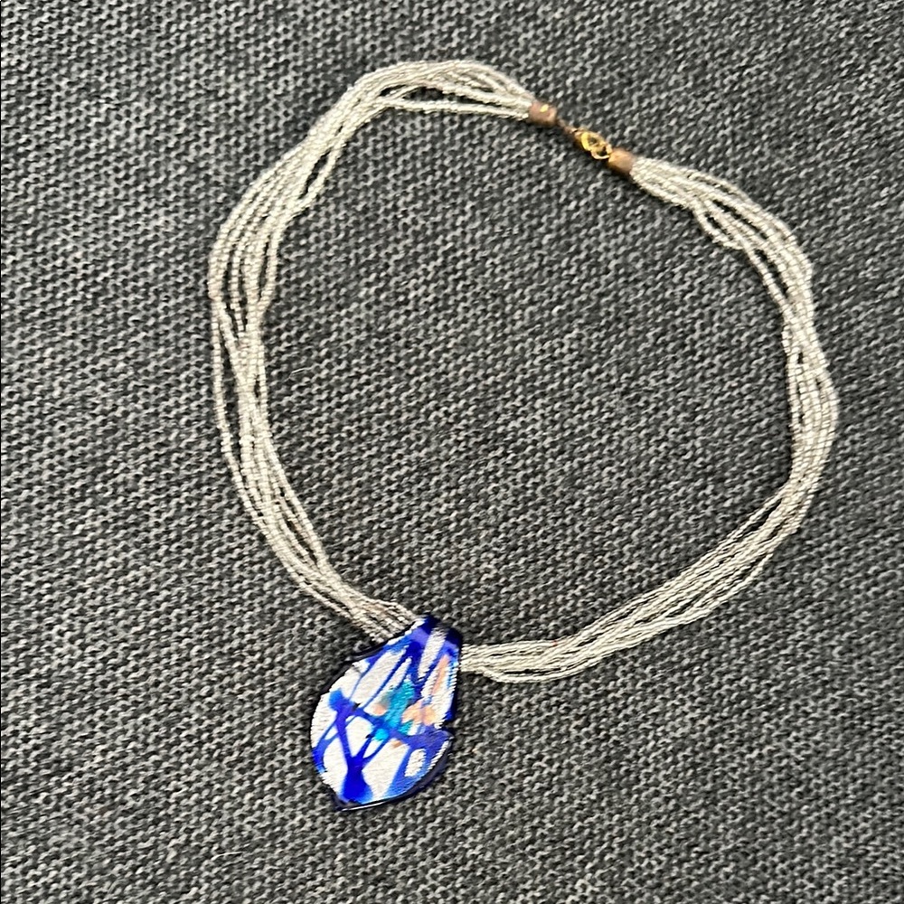 Blue and Silver Multi-Strand Necklace with Swirled Pendant. Used.
